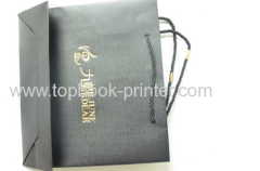 Custom designed black cotton rope gold stamping craft paper packaging bag