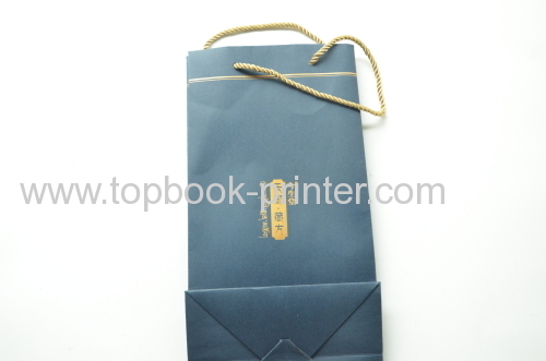 gold stamping ivory board paper clothing packaging bag with yellow cotton ropes