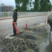 The procedure of repairing concrete bridge deck pothole.