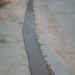 how to repair large cracks in concrete driveway