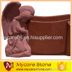 Angel kneeling red tombstone