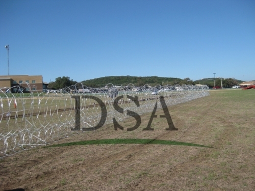 razor wire on palisade fence for security system 