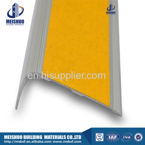 Yellow abrasive exterior stair nosing with adhesive carborundum inserted
