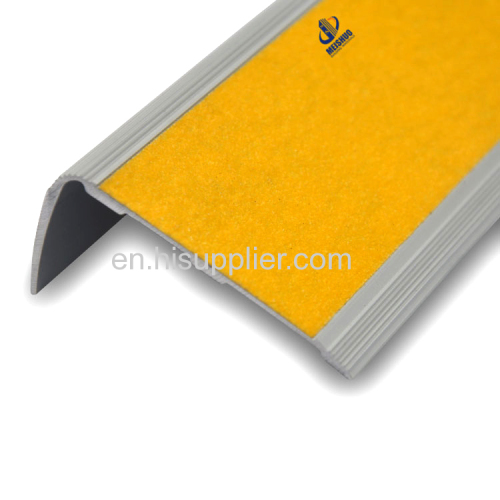 Yellow abrasive exterior stair nosing with adhesive carborundum inserted