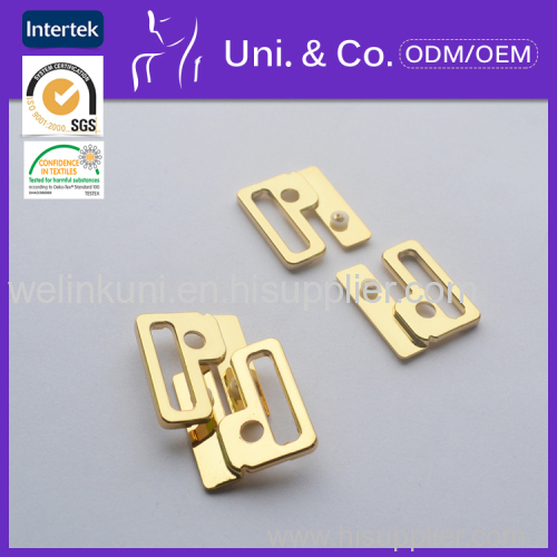 Alloyed front closure buckle for swimwear accessories