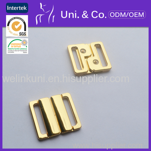 Alloyed front closure buckle for swimwear accessories