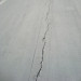 Repairing cracks in a concrete driveway