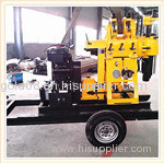 Water well drilling rig and borehole drilling machine