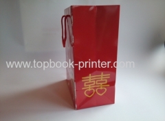 Gloss laminated art paper wedding gift packaging bag with red cotton rope printing