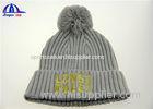 100% Acrylic Knit Beanie With Pom On Top And Gold Color Logo On Front