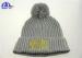 100% Acrylic Knit Beanie With Pom On Top And Gold Color Logo On Front