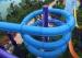 Blue Fiber Glass Closed Spiral Tube Slide In An Amusement Park Water Slide