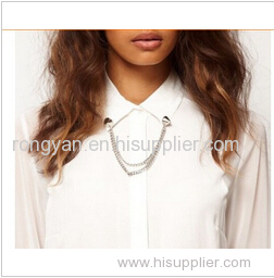 Women's white shirt with golden chain on collar