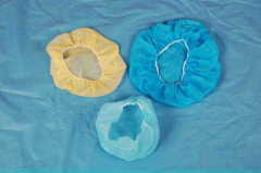 Disposable nonwoven surgical hats