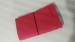 Red cloth cover rubber band bound notebook for clothing shop