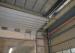 Torsional spring break proof device industrial sectional door with track design