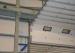 Emergency manual chain support insulated overhead door with small vision window