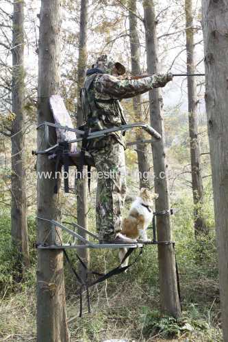 One man hang on tree stand