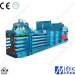 with conveyor feeding waste paper recycling baler