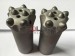 Tapered button drill bits