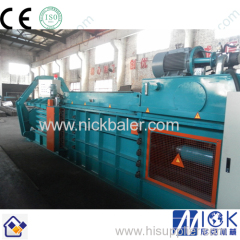 Hydrauic compactor strapping machine