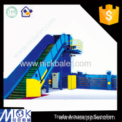 Baling machine with automatic strapping machine