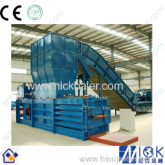 Baling machine with automatic strapping machine