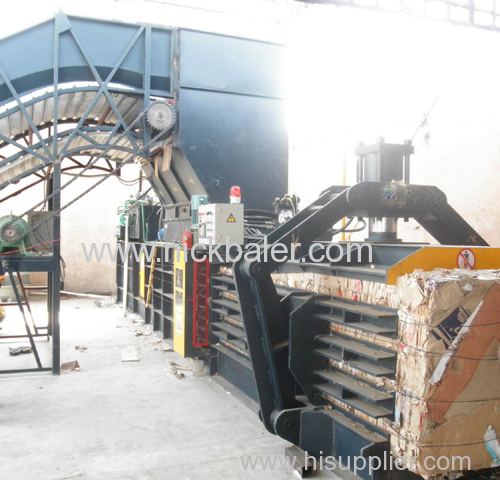 opened baler with semi-automatic strapping machine