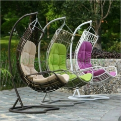 Outdoor patio rattan wicker material hammock with colorful cushions