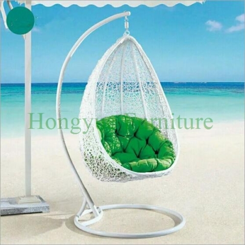 Colorful rattan wicker hammock with cushions for outdoor