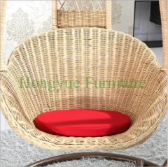Light yellow rattan hammock with red cushions supplier