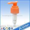 Orange plastic lotion pump for shampoo bottle