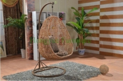 Yellow color rattan hammock with grey cushions