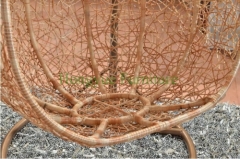 Yellow color rattan hammock with grey cushions