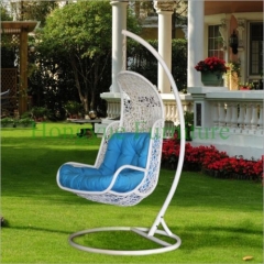 Black rattan wicker hammock with blue cushions