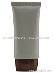 Toiletries packaging tube with acrylic top cap