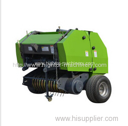 Tractor mounted round baler