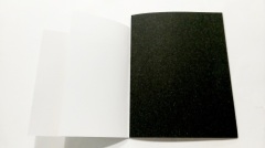 Saddle stitched booklet with dust jacket printing