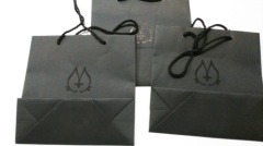 Black textured paper gift bag printing