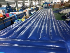 Inflatable floating air tumble track