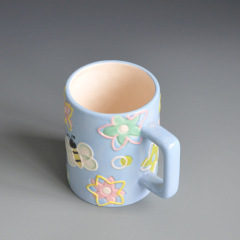 Light blue empaistic ceramic coffee cup