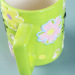 Light blue empaistic ceramic coffee cup with animal print