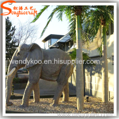 Large outdoor artificial Roystonea regia palm trees