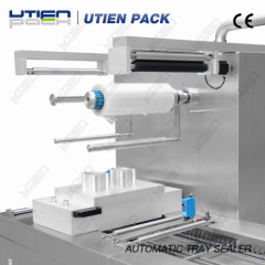 Automatic continuous tray sealing machine