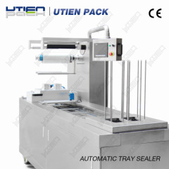 Automatic continuous tray sealing machine