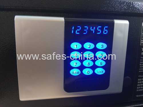 Electronic in-room safe box with motorized locking system and backlit panel for hotel bedroom