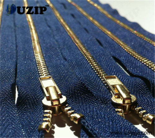 highly polished gold metal zippers