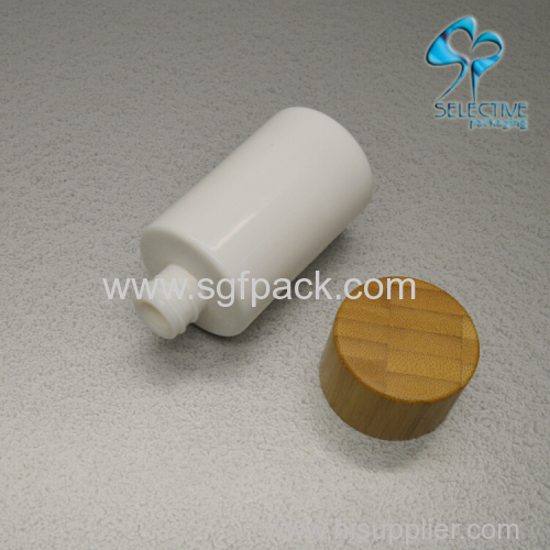 white porcelain vase glass bottle with bamboo cap or pump cosmetics bamboo packaing