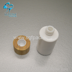 white porcelain vase glass bottle with bamboo cap or pump cosmetics bamboo packaing