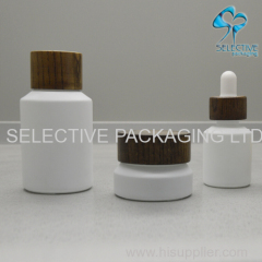 white coating inclined shoulder glass cosmetic packaging lotion bottle and cream jar series with ash wood screw lids